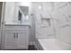 Bathroom featuring a glass vessel sink and marble tile at 2335 W Beach St, Tampa, FL 33607