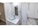 Clean bathroom with glass vessel sink and marble tile at 2335 W Beach St, Tampa, FL 33607