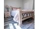 Bedroom with light wood frame bed and a nightstand at 2335 W Beach St, Tampa, FL 33607