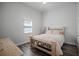 Comfortable bedroom featuring hardwood floors, neutral decor, and soft, natural light, inviting relaxation at 2335 W Beach St, Tampa, FL 33607