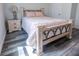 Bedroom with a light wood frame bed and gray flooring at 2335 W Beach St, Tampa, FL 33607