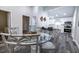 Modern dining area with glass table, metal chairs, and view of kitchen at 2335 W Beach St, Tampa, FL 33607