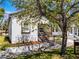 Charming stucco home with a cozy front porch and well-maintained landscaping at 2335 W Beach St, Tampa, FL 33607