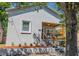 Charming stucco home with a cozy front porch and well-maintained landscaping at 2335 W Beach St, Tampa, FL 33607