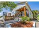 Side view of a charming house with a well-maintained yard and new landscaping at 2335 W Beach St, Tampa, FL 33607
