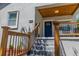 Stylish blue front door with wood accents and modern metal railing at 2335 W Beach St, Tampa, FL 33607