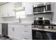 Bright kitchen with stainless steel appliances and white cabinets at 2335 W Beach St, Tampa, FL 33607