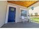 Cozy porch with two metal chairs and a wood ceiling at 2335 W Beach St, Tampa, FL 33607