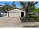 House exterior showcasing a two-car garage at 2892 North Rd, Clearwater, FL 33760