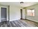 Bright bedroom with wood-look floors and access to other rooms at 2910 N 33Rd St, Tampa, FL 33605