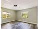 Bright bedroom with two windows and wood-look floors at 2910 N 33Rd St, Tampa, FL 33605