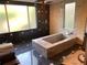 Spa like bathroom with large granite soaking tub at 3301 W Corona St, Tampa, FL 33629