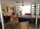 Main bedroom with large windows and mid century modern decor at 3301 W Corona St, Tampa, FL 33629