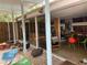 Mid-century modern home with a view of the patio and kitchen through sliding glass doors at 3301 W Corona St, Tampa, FL 33629