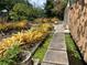 Landscaped backyard with a pond and stone pathway at 3301 W Corona St, Tampa, FL 33629