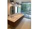 Modern bathroom with double vanity and patterned tile at 3301 W Corona St, Tampa, FL 33629