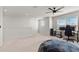 Large bedroom with window and carpeted floor at 10662 Hawks Landing Dr, Land O Lakes, FL 34638