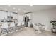 Modern kitchen with white cabinets, granite countertops, and breakfast bar at 10662 Hawks Landing Dr, Land O Lakes, FL 34638