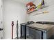 Laundry room with washer, dryer, and shelving for storage at 10662 Hawks Landing Dr, Land O Lakes, FL 34638