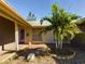 House exterior with red front door and palm trees at 3900 Berwick Dr, New Port Richey, FL 34652