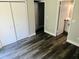 Bright bedroom with double closets and wood-look flooring at 7108 Waterside Dr # 103, Tampa, FL 33617