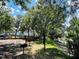 Community with playground, grills, and wooded area at 7108 Waterside Dr # 103, Tampa, FL 33617