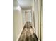 Hallway with wood-look flooring and neutral walls at 7108 Waterside Dr # 103, Tampa, FL 33617