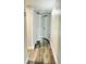 Hallway with light walls, wood-look flooring, and closet at 7108 Waterside Dr # 103, Tampa, FL 33617