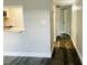Hallway with wood-look flooring and neutral walls at 7108 Waterside Dr # 103, Tampa, FL 33617