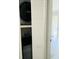 Stacked washer and dryer in a closet with louvered doors at 7108 Waterside Dr # 103, Tampa, FL 33617
