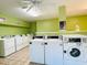 Clean laundry room with several washers and dryers available for residents at 7108 Waterside Dr # 103, Tampa, FL 33617