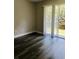 Living room with sliding doors leading to a patio and water view at 7108 Waterside Dr # 103, Tampa, FL 33617