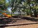 A nice community playground with a slide and a swing set in a beautiful grassy area at 7108 Waterside Dr # 103, Tampa, FL 33617