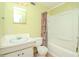 Small bathroom with shower/tub combo and vanity at 4116 Haines N Rd, St Petersburg, FL 33703