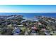 An aerial view showcasing a house nestled in a neighborhood with water access nearby at 4911 W Juno St, Tampa, FL 33629