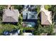 Aerial view of homes with swimming pools in a lush neighborhood at 4911 W Juno St, Tampa, FL 33629