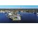 Aerial view of waterfront property showcasing a home and private pool at 4911 W Juno St, Tampa, FL 33629