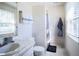 Bright bathroom with shower, toilet and sink at 4911 W Juno St, Tampa, FL 33629