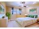 Cozy bedroom with a comfortable bed, green accents, and calming decor at 4911 W Juno St, Tampa, FL 33629