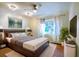 Spacious bedroom with a large bed, ample natural light, and modern decor at 4911 W Juno St, Tampa, FL 33629