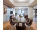 Modern concrete dining table with brown leather chairs in open concept dining area at 4911 W Juno St, Tampa, FL 33629