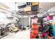 Garage with overhead storage and shelving at 4911 W Juno St, Tampa, FL 33629