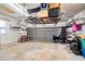 Garage with overhead storage and shelving at 4911 W Juno St, Tampa, FL 33629