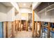 Hallway under renovation with exposed plumbing and walls at 4911 W Juno St, Tampa, FL 33629