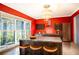 Red-walled kitchen with stainless steel appliances and a large island at 4911 W Juno St, Tampa, FL 33629