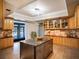 Spacious kitchen with stainless steel appliances and light wood cabinets at 4911 W Juno St, Tampa, FL 33629