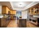 Spacious kitchen with stainless steel appliances and light wood cabinets at 4911 W Juno St, Tampa, FL 33629