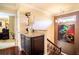 Upstairs landing with built-in storage and modern art at 4911 W Juno St, Tampa, FL 33629