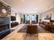 Large living room with a fireplace and plenty of seating, creating a warm and inviting atmosphere at 4911 W Juno St, Tampa, FL 33629