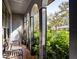 Covered porch with brick flooring and lush landscaping at 4911 W Juno St, Tampa, FL 33629